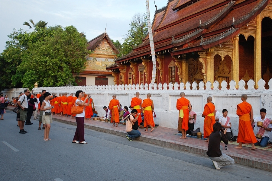 Luang Prabang City Tour - Monk in LUang Prabang